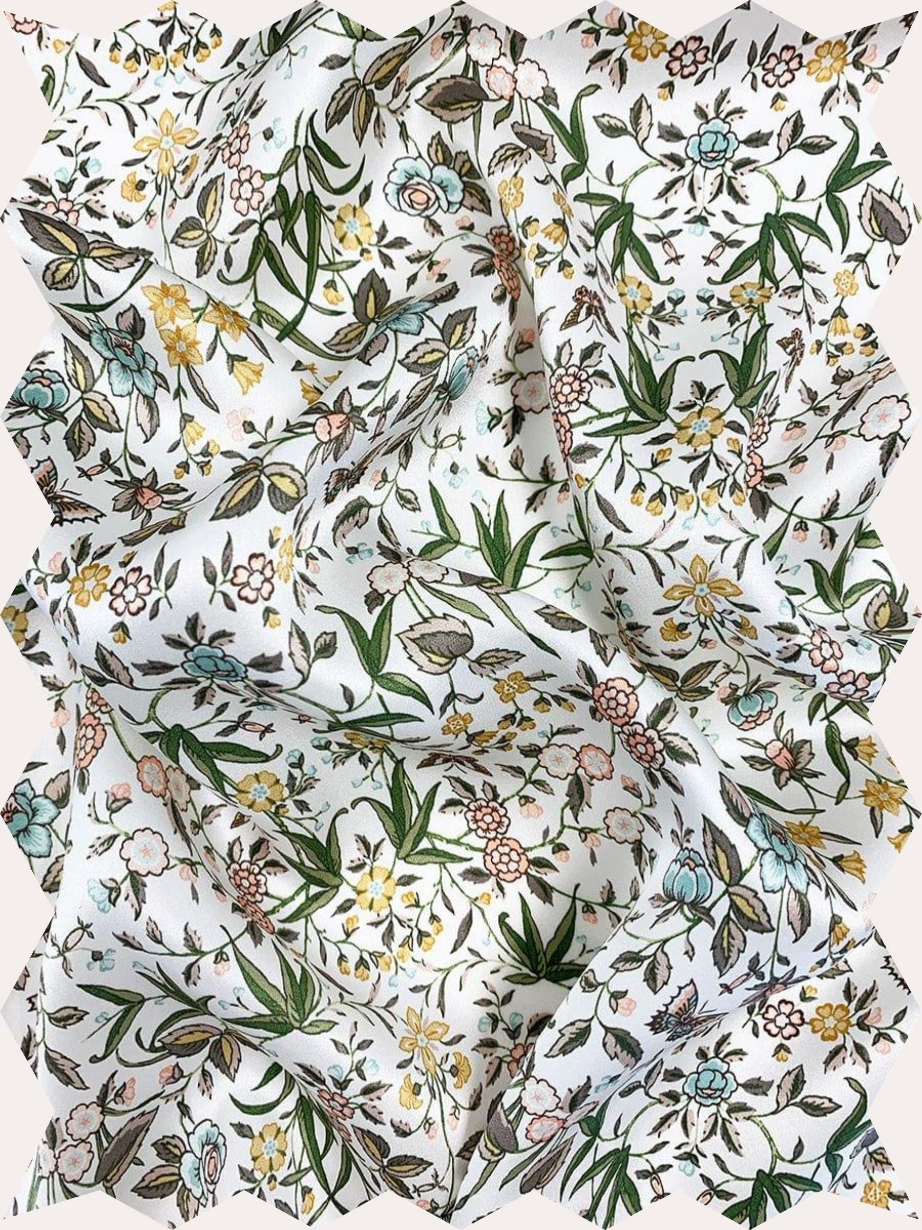 Inspired by an artwork from the liberty archive, this botanical print features trails of beautifully illustrated flowers, complimented by elegant leaves and colourful camouflaged butterflies.