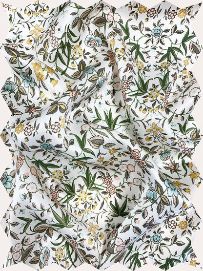 Inspired by an artwork from the liberty archive, this botanical print features trails of beautifully illustrated flowers, complimented by elegant leaves and colourful camouflaged butterflies.